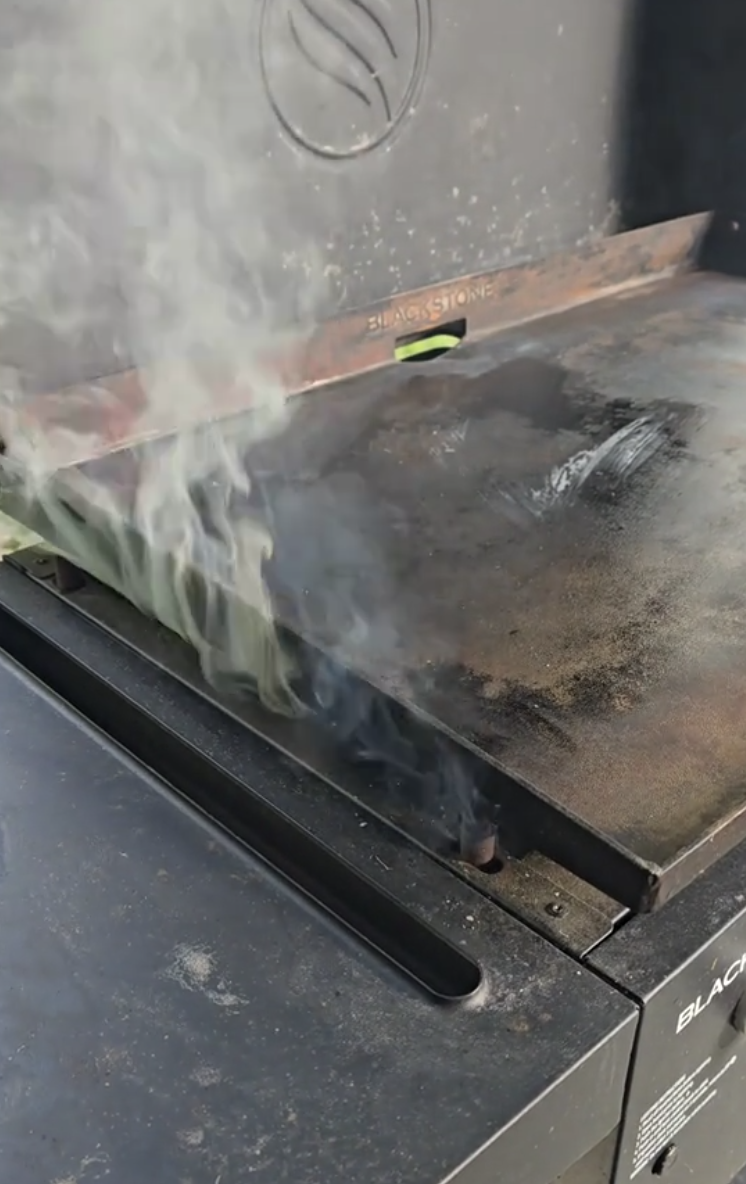 grill with smoke coming out of it